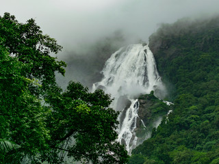 Image Of Dudhsagar waterfall and Scenic Train Route in raining season , travel to goa by train, Indian Train - obrazy, fototapety, plakaty