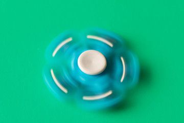 Rotating blue spinner . Isolated on turquoise background