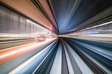 Fototapeta na wymiar Motion blur of train moving inside tunnel in Tokyo, Japan