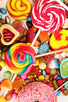 candies with jelly and sugar. colorful array of different childs sweets and treats.