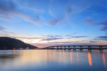 Fototapeta na wymiar Beautiful long bridge in Chantaburi province at sunset twilight, Thailand