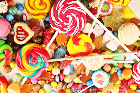 candies with jelly and sugar. colorful array of different childs sweets and treats.