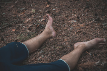 corpse of a man in the woods