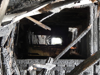 Ruins of a burned wooden house