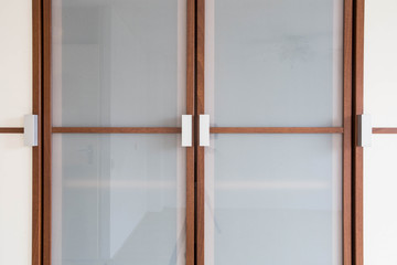 wooden white closet doors closeup for clothes modern new design