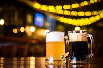 light and dark beer on a pub background.