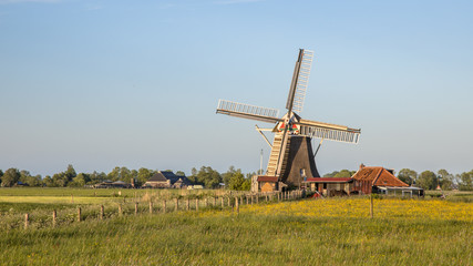 Fototapeta premium Wooden windmill on countryside