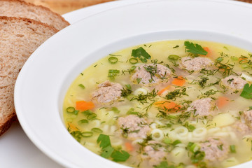 A bowl of soup on the table. Useful food.