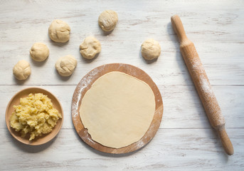 Cooking traditional pies with potatoes. Placinta, traditional Moldovan pastries
