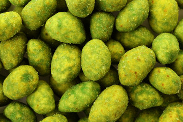 Peanuts in green mustard breaded as background