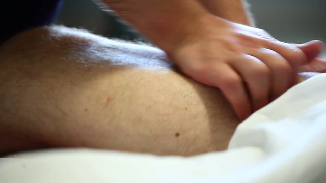man does full body massage back legs feet hands