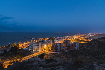 Fototapeta na wymiar City illuminated at sunrise, before sunrise