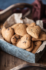Chocolate cookies on wooden  rustic table. Chocolate chip cookies in the shape of a heart. Homemade cookies