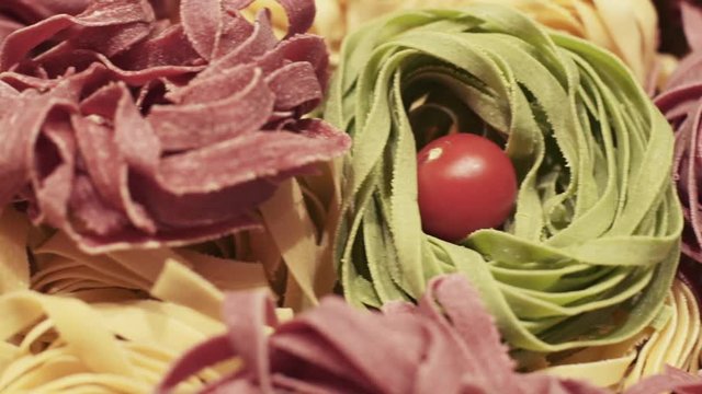 Different kinds of pasta and cherry tomatoes
