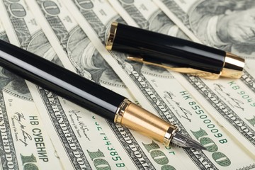 Parker Fountain Pen and Pen Cap Lying on the Money - Close Up