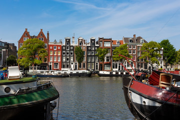 Historical canalhouses on the Amstel canal in the old center of Amsterdam, the Netherlands.