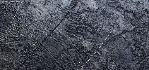 Black concrete background. Top view.