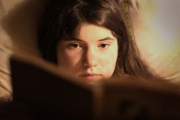 introvert teenager girl reading book