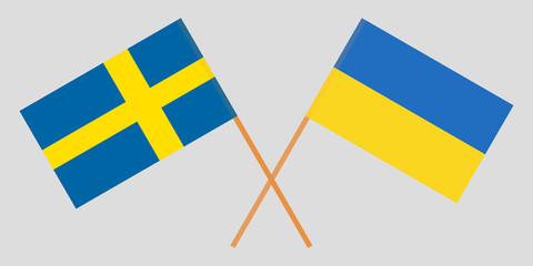 Crossed flags Ukraine and Sweden. Official colors. Correct proportion. Vector