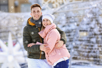 Portrait of happy couple outdoors on winter day