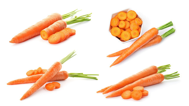 Set with fresh ripe carrots on white background