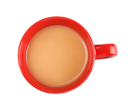 Cup with black tea and milk on white background