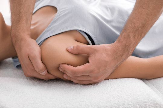Young woman receiving massage in salon, closeup
