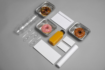 Composition with items for mock up design on gray background. Food delivery service