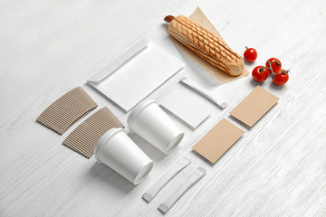 Composition with items for mock up design on wooden background. Food delivery service
