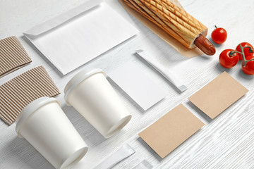 Composition with items for mock up design on wooden background. Food delivery service