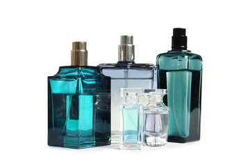 Different perfume bottles on white background