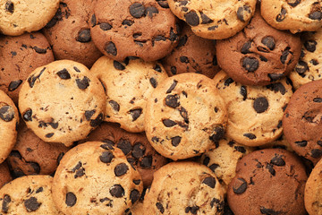 Tasty chocolate cookies as background, closeup