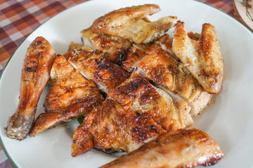 grilled whole chicken on white plate thai traditional north east food
