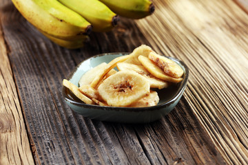 Banana chips, dehydrated slices of fresh ripe bananas.