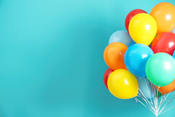 Bunch of bright balloons and space for text against color background - obrazy, fototapety, plakaty