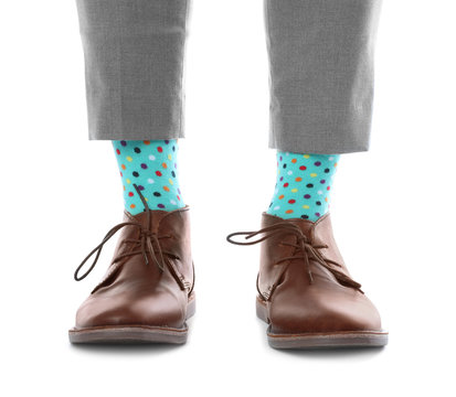 Man Wearing Stylish Socks And Shoes On White Background, Closeup