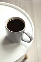 Cup of fresh aromatic coffee on light table. Food photography