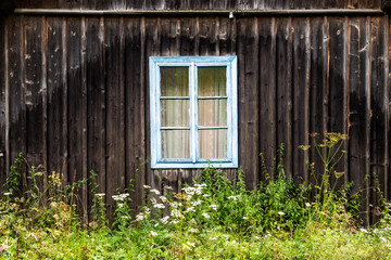 window in the old wooden house in the Carpathians