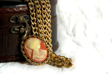 decor, women's jewelry gold chain, cameo brooch with leather gift box.