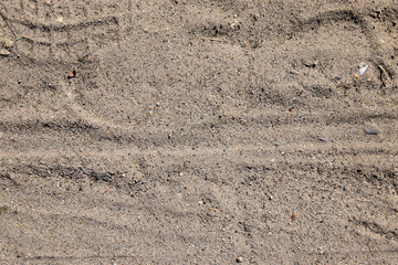 Footprint On Dark Sand With Tiny Rocks Texture