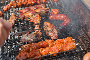 Assorted grilled meat on a barbecue