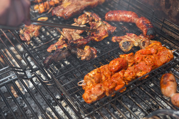 Assorted grilled meat on a barbecue