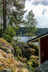 A typical red boat house  on the shore of the Saimaa lake in Finland - 4