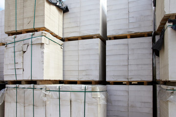 New aerated concrete blocks on pallets stored at warehouse