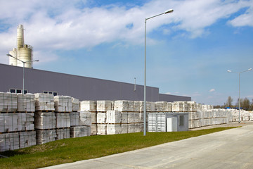 Fototapeta premium Defective aerated concrete blocks on pallets in front of factory