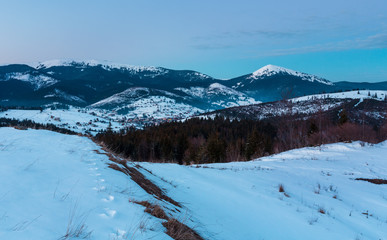 Evening twilight winter mountain ridge panorama