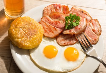 Breakfast with Fried Egg and Cutlets on the Table