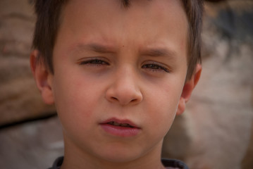 Portrait of white child with serious gesture