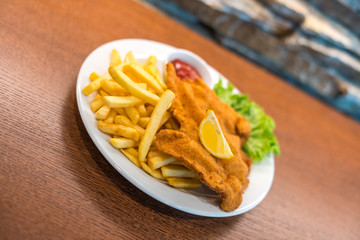 Schnitzel with french fries and salad