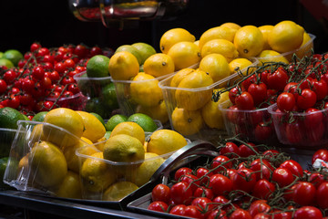 Lemon, lima and tomatoes on a market